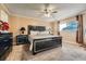 Spacious bedroom featuring a comfortable bed, stylish nightstands, and soft, neutral carpeting at 16333 E Carolina Dr, Aurora, CO 80017