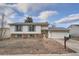 Charming two-story home with blue shutters, a brick foundation, and a two car garage at 16333 E Carolina Dr, Aurora, CO 80017
