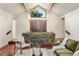 Inviting entryway with a stone accent wall and hardwood floors at 3 Columbine Ln, Littleton, CO 80123