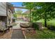 The beautiful backyard has an outdoor kitchen with a grill, a shed, and grass at 8764 W 95Th Ave, Broomfield, CO 80021