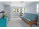 This bedroom is filled with natural light, has a pull-out couch and a blue dresser at 8764 W 95Th Ave, Broomfield, CO 80021