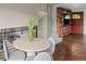 Dining area with hardwood floors, views to the living room, modern furnishings, and natural light at 8764 W 95Th Ave, Broomfield, CO 80021