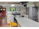 Updated kitchen featuring stainless appliances, stone countertops, hardwood floors, and an open layout at 8764 W 95Th Ave, Broomfield, CO 80021