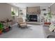 Cozy living room with a stone fireplace, built-in shelves, comfortable seating and lovely decor at 8764 W 95Th Ave, Broomfield, CO 80021