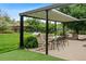 A covered patio with a dining set and outdoor furniture offers a perfect place to relax at 8764 W 95Th Ave, Broomfield, CO 80021