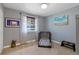 A bedroom featuring a window, carpeted floor, and a dog cage at 1746 Shavano St, Longmont, CO 80504