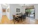 Dining room with modern lighting, and sliding glass doors leading to the outside deck at 1746 Shavano St, Longmont, CO 80504