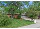 Charming single-story home with a well-manicured lawn and mature trees providing ample shade at 1746 Shavano St, Longmont, CO 80504