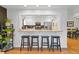 Kitchen view with breakfast bar, stainless steel appliances, and modern countertops at 1746 Shavano St, Longmont, CO 80504