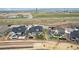Aerial view showcasing the house's backyard with a green lawn, surrounded by fence and hardscaping at 17843 W 93Rd Pl, Arvada, CO 80007