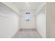 Spacious walk-in closet with ample shelving, perfect for organized storage and personal items at 17843 W 93Rd Pl, Arvada, CO 80007