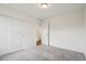 Neutral bedroom with carpet, closet with sliding doors, and white trim for a calm retreat at 17843 W 93Rd Pl, Arvada, CO 80007