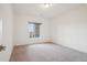 Bright bedroom with carpet, window with blinds, and white walls for versatile decor options at 17843 W 93Rd Pl, Arvada, CO 80007
