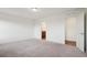 A spacious bedroom offers neutral carpeting and an ensuite bathroom at 17843 W 93Rd Pl, Arvada, CO 80007