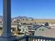 Beautiful mountain views from the deck of this home with solar panels in a suburban neighborhood at 17843 W 93Rd Pl, Arvada, CO 80007