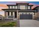 Charming two-story home with stone accents, a two-car garage, and well-manicured landscaping at 17843 W 93Rd Pl, Arvada, CO 80007