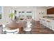 Bright and airy living space with fireplace, ample natural light, and seamless access to the kitchen at 17843 W 93Rd Pl, Arvada, CO 80007