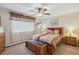 Comfortable bedroom with a ceiling fan, window, and ample natural light at 580 S Clinton St # 12C, Denver, CO 80247