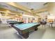 Spacious billiards room with multiple pool tables and comfortable seating for game nights at 580 S Clinton St # 12C, Denver, CO 80247