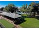 Aerial shot of community area featuring pool, picnic shelter, bocce court and lush landscaping at 580 S Clinton St # 12C, Denver, CO 80247