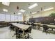 Bright and spacious craft room with tables, chairs, and storage for creative projects at 580 S Clinton St # 12C, Denver, CO 80247