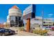 The exterior of the Windsor Gardens features well-maintained landscaping and a prominent sign for the restaurant and golf course at 580 S Clinton St # 12C, Denver, CO 80247