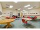 Community game room with card tables, seating, and a relaxed atmosphere for social gatherings at 580 S Clinton St # 12C, Denver, CO 80247