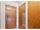 Hallway featuring wood doors and white walls at 580 S Clinton St # 12C, Denver, CO 80247