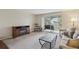 Inviting living room with a fireplace and access to a charming balcony at 580 S Clinton St # 12C, Denver, CO 80247