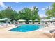 Outdoor pool area with plenty of lounge chairs and tables, perfect for relaxing and enjoying the sunshine at 580 S Clinton St # 12C, Denver, CO 80247