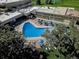 Overhead shot of outdoor pool and lounge area at Windsor Gardens, featuring umbrellas and lounge seating at 580 S Clinton St # 12C, Denver, CO 80247