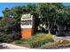 Exterior shot of Windsor Gardens signage, showing community features and lush landscaping at 580 S Clinton St # 12C, Denver, CO 80247