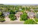 Expansive aerial shot showcasing a suburban home with mature trees and a peaceful neighborhood setting at 10565 Kalahari Ct, Lone Tree, CO 80124