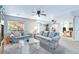 Open finished basement area, furnished with floral couches, a glass coffee table, and a separate office nook at 10565 Kalahari Ct, Lone Tree, CO 80124