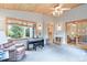 Bonus room with wood-paneled ceiling, comfortable seating, piano and carpeted floors at 10565 Kalahari Ct, Lone Tree, CO 80124
