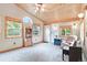 Bonus room featuring wood ceiling, large windows for natural light, and comfortable seating at 10565 Kalahari Ct, Lone Tree, CO 80124