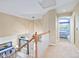 Hallway with a view of the entry and front door with a view to a bedroom at 10565 Kalahari Ct, Lone Tree, CO 80124