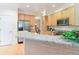 Bright kitchen featuring granite countertops and stainless-steel appliances and breakfast bar at 10565 Kalahari Ct, Lone Tree, CO 80124