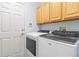 Convenient laundry room featuring modern, front-load Whirlpool washer and dryer at 10565 Kalahari Ct, Lone Tree, CO 80124