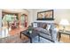 Comfortable living room featuring hardwood floors, a dining area, and a cozy seating arrangement at 10565 Kalahari Ct, Lone Tree, CO 80124