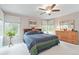 Cozy main bedroom with neutral walls and ceiling fan at 10565 Kalahari Ct, Lone Tree, CO 80124