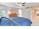 Cozy main bedroom with neutral walls and ceiling fan at 10565 Kalahari Ct, Lone Tree, CO 80124