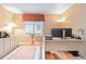 Bright office space featuring hardwood floors, neutral walls, and natural light from the window at 10565 Kalahari Ct, Lone Tree, CO 80124