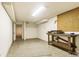 Basement with a workbench, utility area, and an unfinished storage section at 2840 S Heather Gardens Way # A, Aurora, CO 80014