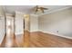 Bright bedroom featuring hardwood floors, crown molding, and neutral color paint at 2840 S Heather Gardens Way # A, Aurora, CO 80014