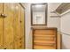 Walk-in closet with wood cabinetry, built-in shelving, and a mirror at 2840 S Heather Gardens Way # A, Aurora, CO 80014