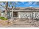 Charming front exterior features an attached garage, and accessible ramp at 2840 S Heather Gardens Way # A, Aurora, CO 80014