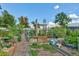 Discover a charming garden with plots, trellises, and greenery under a bright, blue sky at 2840 S Heather Gardens Way # A, Aurora, CO 80014