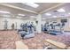 This gym area is carpeted and features multiple treadmills, elipticals, TVs, and weight machines at 2840 S Heather Gardens Way # A, Aurora, CO 80014