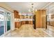 Spacious kitchen featuring tile floors, and modern stainless steel appliances at 2840 S Heather Gardens Way # A, Aurora, CO 80014